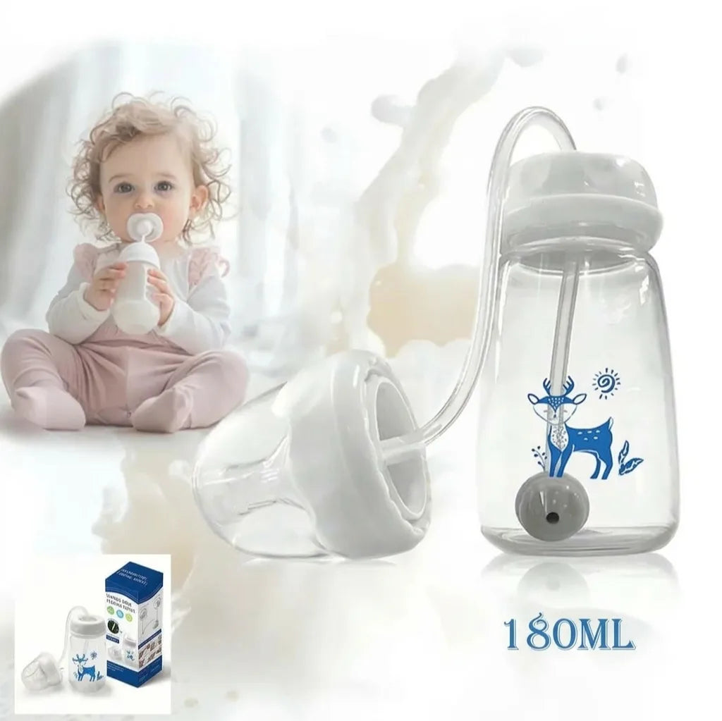 Bébé buvant au biberon, à côté du biberon 3-en-1 à paille lestée de 180 ml
