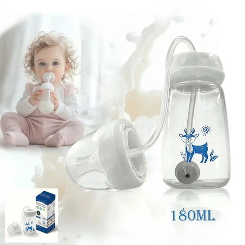 Bébé buvant au biberon, à côté du biberon 3-en-1 à paille lestée de 180 ml